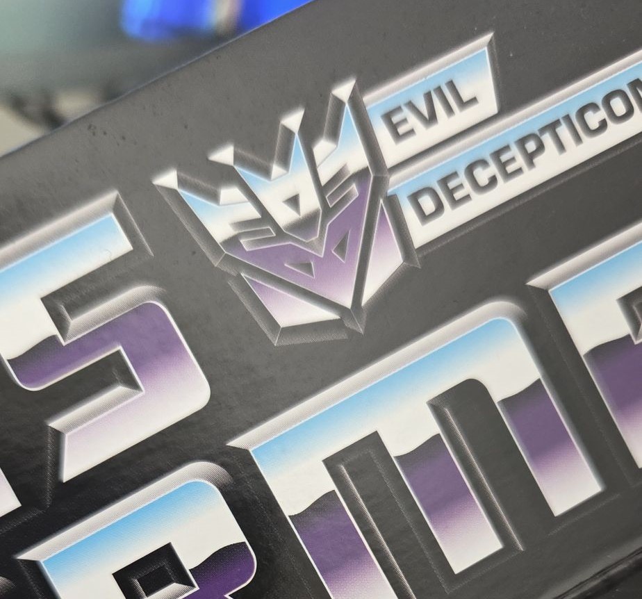 Close up of Decepticon logo on a Soundwave toy box. Close up of Decepticon logo on a Soundwave toy box.